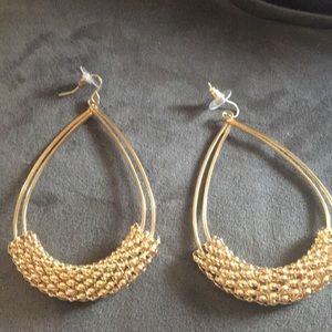 Gold tone large earrings